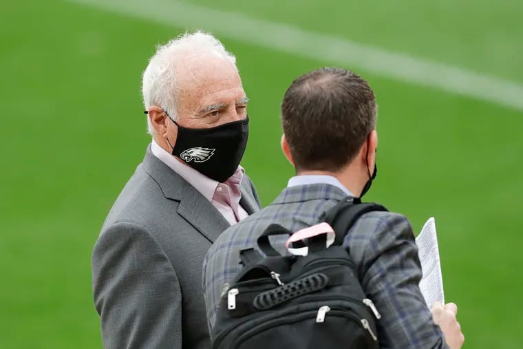 Eagles owner Jeffrey Lurie (left) with General Manager Howie Roseman before a game vs. Pittsburgh last month.