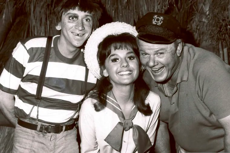 Dawn Wells, center, poses with fellow cast members of "Gilligan's Island," Bob Denver and Alan Hale Jr., in Los Angeles. Wells, who played the wholesome Mary Ann on the 1960s sitcom "Gilligan's Island," has died. Her publicist says Wells died early Wednesday, Dec. 30, 2020, in Los Angeles, of causes related to COVID-19.