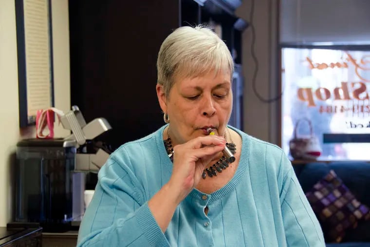 Judy Marcucci tries her first e-cigarette at World's Finest Vape Shop in Bridgeport, Montgomery County. More vape shops are popping up, in both city and suburbs, and governments are taking notice. Vaping is just one practice vulnerable to widespread misinformation spread through social media and other sources, the authors say.