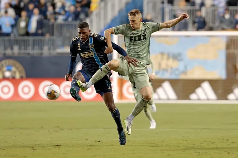 The Union's Damion Lowe (left) duels with LAFC's Stipe Biuk during the first half.