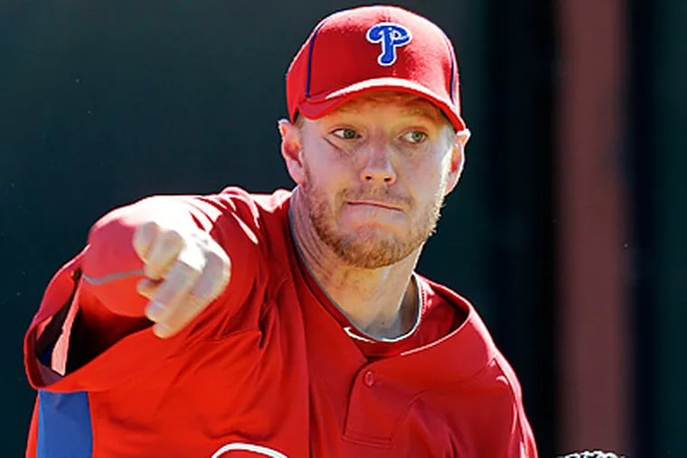 Philadelphia Phillies' Roy Halladay throws during spring training baseball practice in Clearwater, Fla. (AP Photo/Eric Gay)
