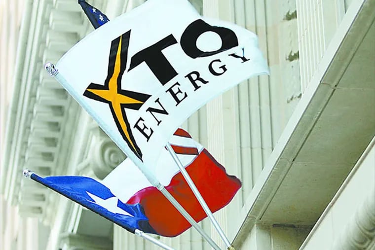 An XTO Energy flag in Fort Worth, Texas. The case has taken on political and symbolic importance. The company says the spill was an accident, not criminal. (AP Photo)