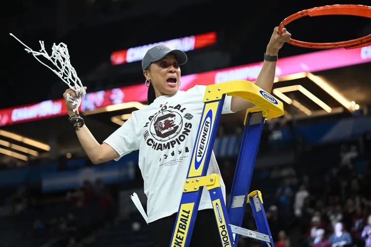 South Carolina head coach Dawn Staley reacts to the crowd after cutting down the net following South Carolina's 64-49 win over UConn in the NCAA Women's Final Four championship game on April 3 at Target Center in Minneapolis.
