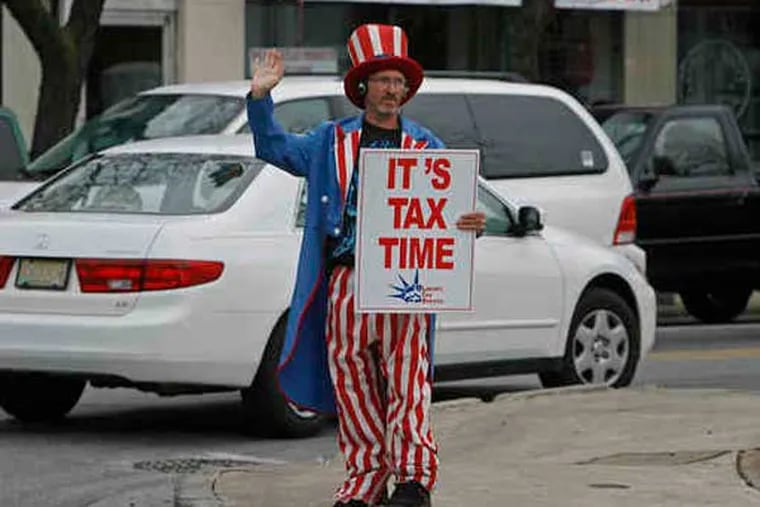 "Uncle Sam" - played here by Bill Addison, 42 - can be found all around, advertising tax preparers. Addison, at Lansdowne and Baltimore Avenues in Lansdowne yesterday, is glad to have the job; he was laid off as a construction handyman in 2009. (File photo: Micheal S. Wirtz / Staff Photographer)