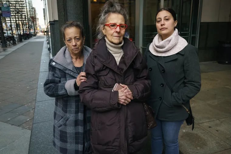 (Left to Right) Cheryl Dimitri Prosinski, Virginia Dimitri, and Brittany Prosinski, family members of Danny Dimitri, who was struck and killed by off-duty police officer Adam Soto, in front of the Criminal Justice Center on January 11, 2019, after Soto's sentencing. JESSICA GRIFFIN / Staff Photographer .