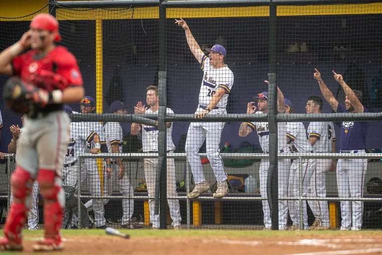 West Chester baseball players celebrate in the dugout during the fourth inning of game one against East Stroudsburg on Friday, May 27, 2022., during the NCAA Super Regionals at West Chester University.