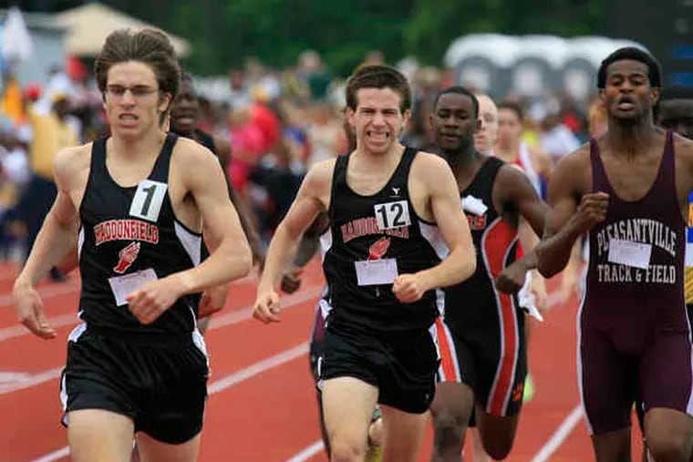 Haddonfield's Ben Potts (left) and Colin Baker finish first and third, respectively, in theboys' 800 meters. The Bulldogs successfully defended their team title in Group 2.