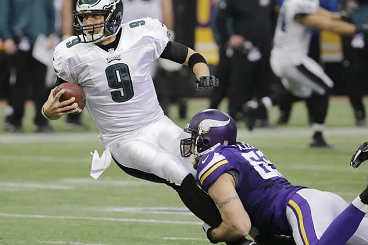 Eagles quarterback Nick Foles is sacked by Vikings defensive end Jared Allen during the second half. (Ann Heisenfelt/AP)