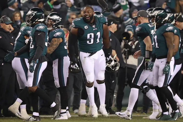 Eagles defensive tackle Fletcher Cox, center, celebrates after the Eagles recovered a fumble in the third quarter against the Cowboys.