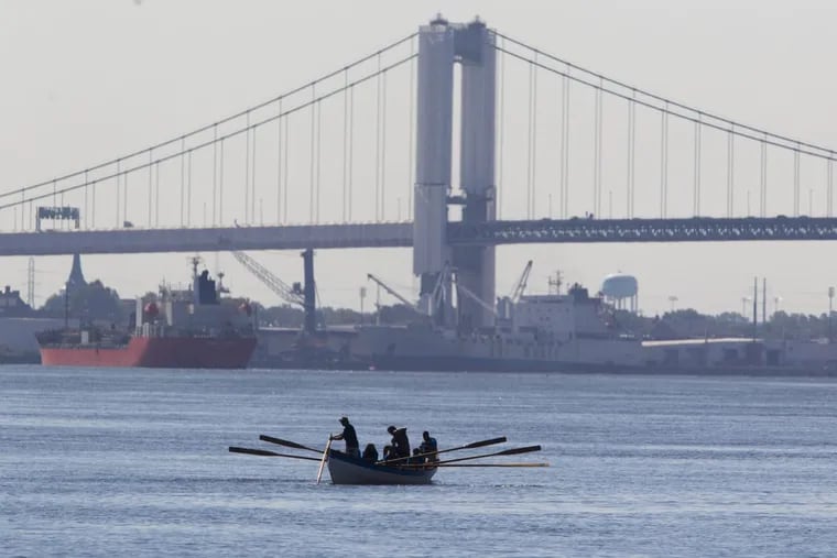 The Walt Whitman Bridge is the backdrop for a high school river expedition.