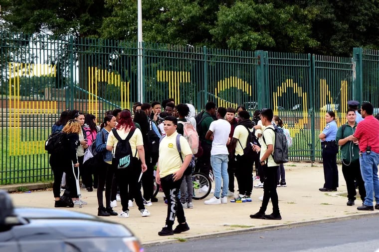 Students leave Thomas A. Edison High School at the end of a school day in 2019. Edison was one of seven Philadelphia high schools where 90% or more of the students were chronically absent.