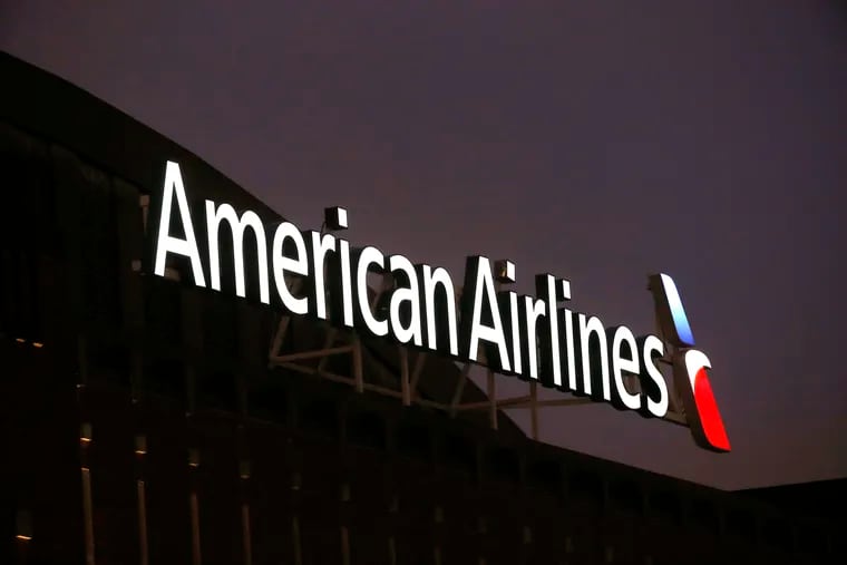 The American Airlines logo on top of the American Airlines Center in Dallas. American Airlines has hired a bus company to carry passengers between Philadelphia and two airports that are only a short hop away by air. The service will start June 3 between Philadelphia International Airport and airports in Allentown, Pennsylvania, and Atlantic City, New Jersey, the airline and Landline said Thursday, April 7, 2022.