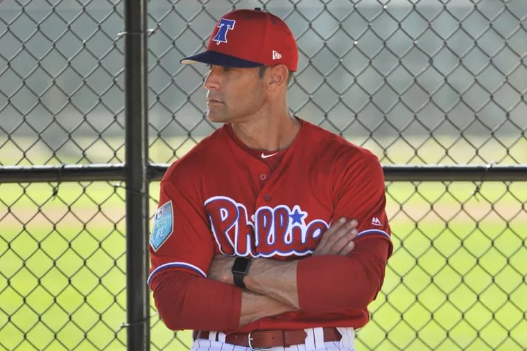 Phillies manager Gabe Kapler watches pitchers in the bullpen during workouts at the Phillies spring training complex on Thursday in Clearwater, Fla.