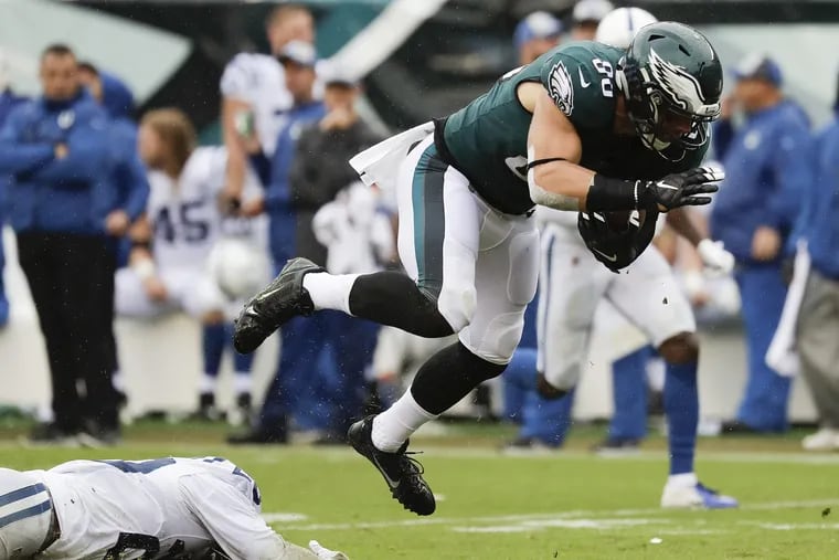 Eagles tight end Zach Ertz leaps past Indianapolis Colts defensive back Malik Hooker during the third-quarter on Sunday, September 23, 2018 in Philadelphia. YONG KIM / Staff Photographer