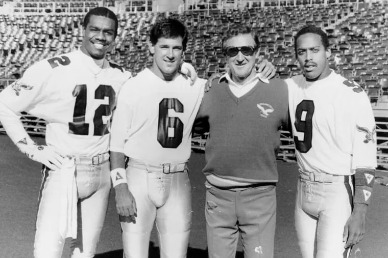 Eagles quarterback coach Doug Scovil with (from left) Randall Cunningham, Matt Cavanaugh, and Don McPherson.