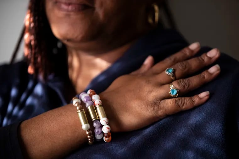 ohndell Gredic shows her Bullets for Life bracelets at her home in Philadelphia. She wants to collect 500 bullets by March. Her 20-year-old son, Nacear Gredic, was killed in 2015.
