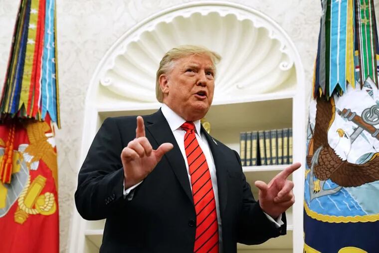 U.S. President Donald Trump answers a reporter's question about the whistle-blower as he leaves the Oval Office after hosting the ceremonial swearing in of Labor Secretary Eugene Scalia at the White House Sept. 30, 2019.