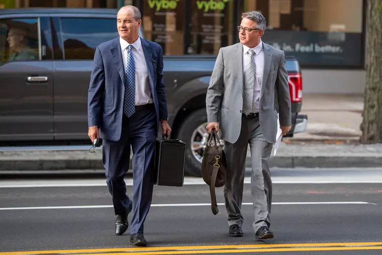 Bobby Henon (right) arriving at the federal courthouse with attorney Brian McMonigle on Oct. 15.