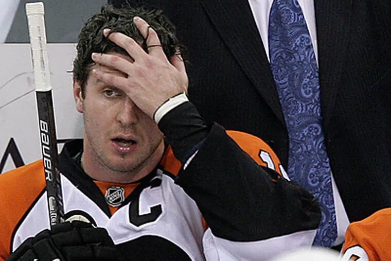 Flyers captain Mike Richards reacts during a recent loss against the Penguins.  The Flyers have been struggling to win games recently. (AP Photo/Gene J. Puskar)