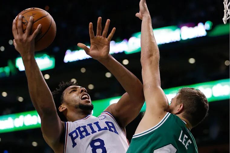 Philadelphia 76ers' Jahlil Okafor (8) shoots over Boston Celtics' David Lee (42) Wednesday, Oct. 28, 2015.