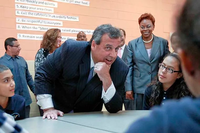 Gov. Chris Christie and Mayor Dana Redd meets with children in the cafeteria during a visit to Octavius V. Catto Community Family School, Camden, September 9, 2014.  ( DAVID M WARREN / Staff Photographer )