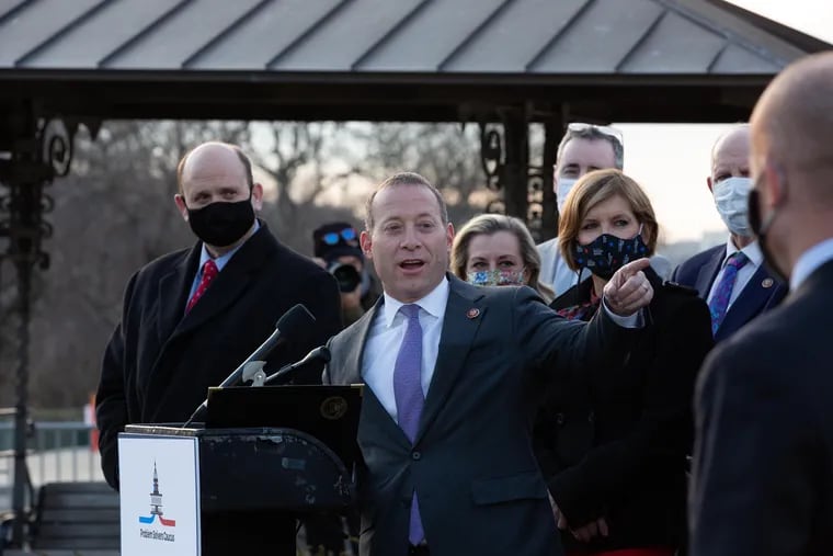 Rep. Josh Gottheimer (D., N.J.) speaks at the podium along with members of the Problem Solvers Caucus to praise a bipartisan emergency COVID-19 relief bill during a news conference outside the U.S. Capitol last December.