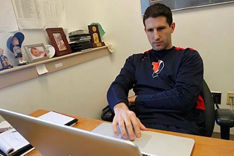 Penn assistant coach Mike Martin studies game footage for their next opponent. (Alejandro A. Alvarez/Staff Photographer)
