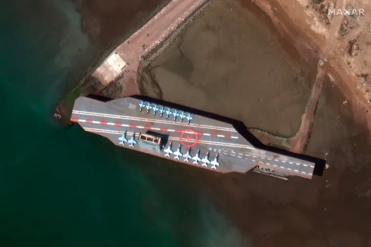 In this Feb. 15 satellite photo provided on July 27 by Maxar Technologies, a mockup aircraft carrier built by Iran is seen at Bandar Abbas, Iran, before being put to sea.
