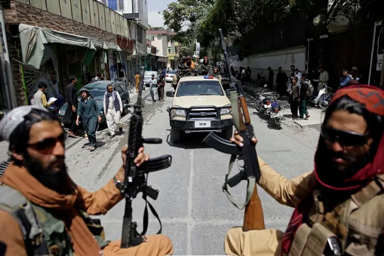 Taliban fighters patrol Kabul, Afghanistan on Thursday, August 19, 2021. Volunteer veterans groups are trying to save Afghan translators, but they need cooperation and funding from the U.S. State Department, which seems to have no plan, writes columnist Trudy Rubin.