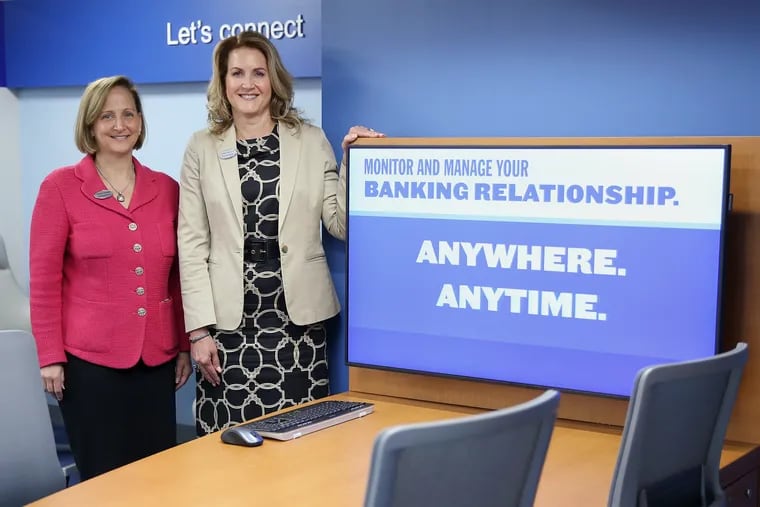 Susan Lonergan, regional president, (left) and JoBeth Mauriello, regional consumer executive, in the small-business resource area at Fulton Bank's new branch in Brewerytown, the first bank in the Philadelphia neighborhood in more than 30 years.