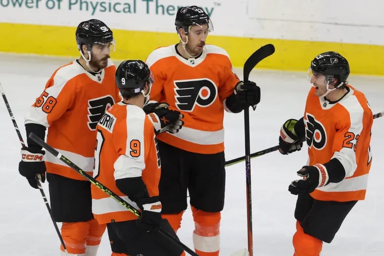 Kevin Hayes (center), who scored two goals, was one of the Flyers' leaders who stepped up to help the team snap their 10-game losing streak on Tuesday.
