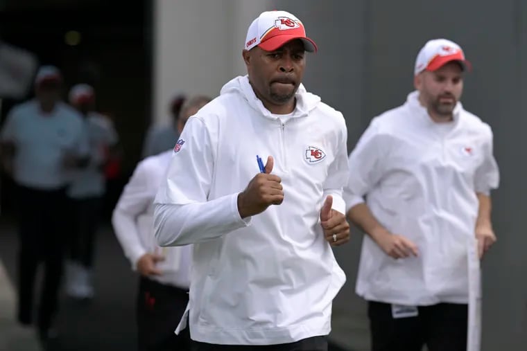 Todd Pinkston (front) is in his first season as the Kansas City Chiefs' running backs coach.