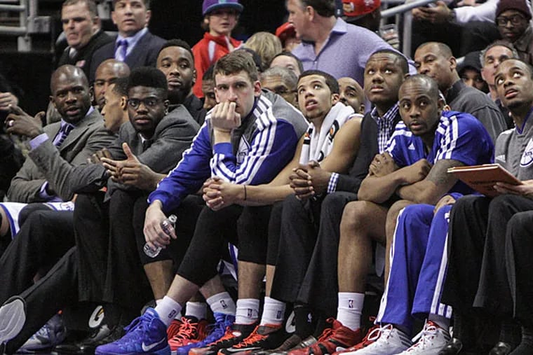 The Sixers sit on the bench during a loss to the Miami Heat. (Steven M. Falk/Staff Photographer)