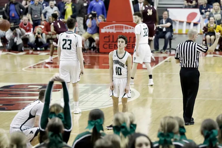 Pennridge players including # 10 Nick Dunn about to lose in overtime during the Pennridge vs. Kennedy Catholic H.S. PIAA Class 6A boys basketball state championship game at the Giant Center in Hershey, Pa. on March 23, 2019.  Pennridge lost 64-62.