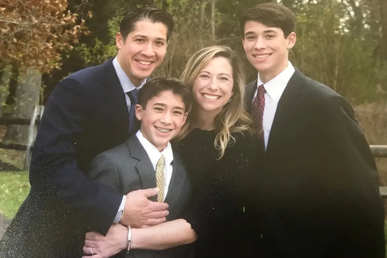 Stephanie Austin with her husband Matt and their two sons.
