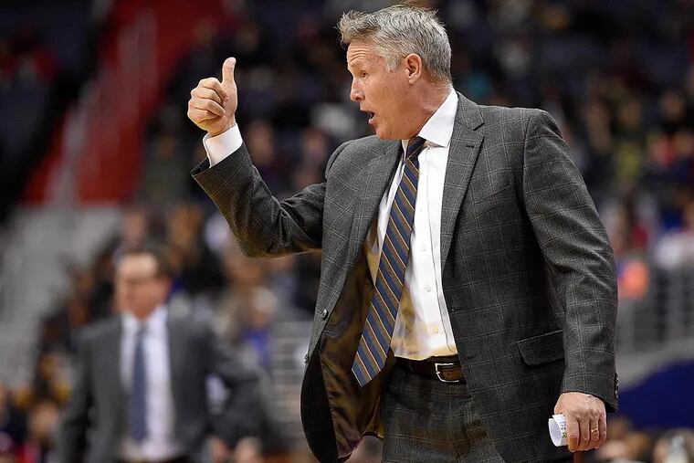 Philadelphia 76ers head coach Brett Brown gestures during the first half of an NBA basketball game against the Washington Wizards, Saturday, Jan. 14, 2017, in Washington.
