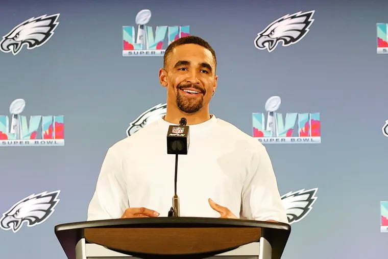 Eagles quarterback Jalen Hurts smiles answering questions during the team media availability for the Super Bowl.