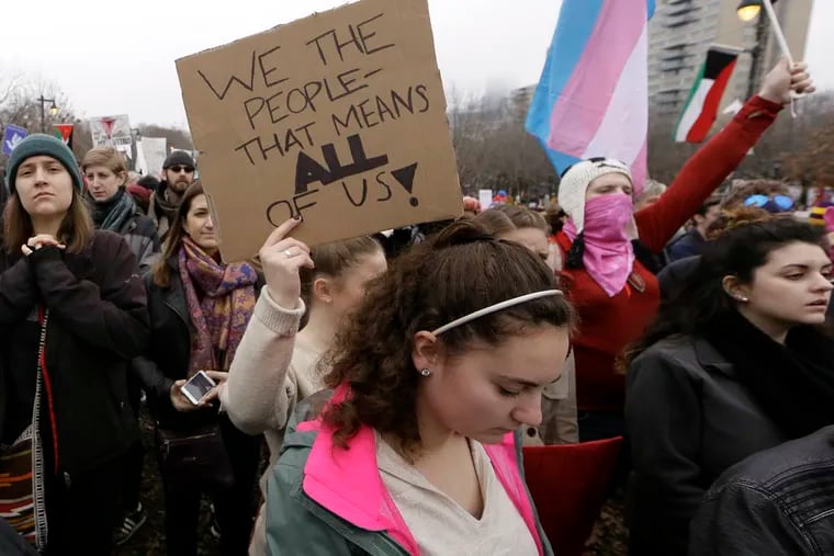Marchers listen to the speakers during the Philadelphia segment of the National Women's March on the Benjamin Franklin Parkway on Jan. 21, 2017.