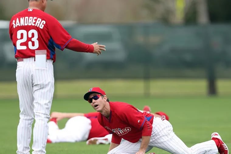 Phillies manager Ryne Sandberg and second baseman Chase Utley. (David Maialetti/Staff Photographer)