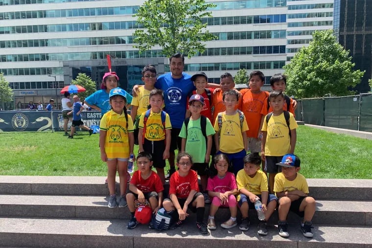 Luis Uribe and his players at LOVE Park in 2019 to celebrate the EPYSA and Union's partnership with the City of Philadelphia to build 15 new mini-pitches and two signature fields