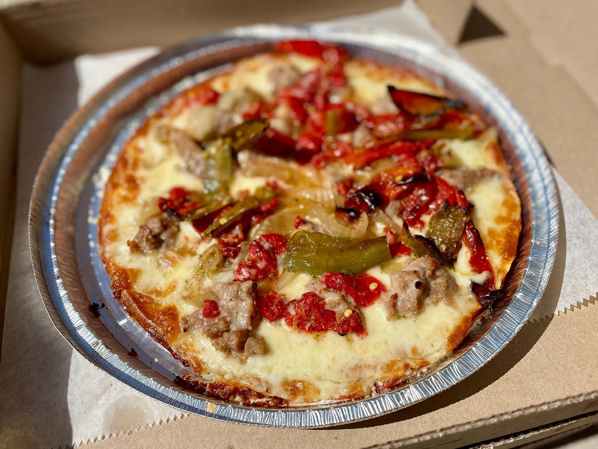 A sausage and pepper pizza on a gluten-free crust from SliCE in South Philadelphia.