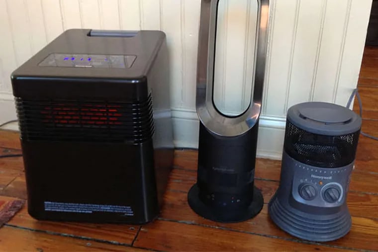 No, not a shot of a "Star Wars" casting call - these are the Honeywell My Energy Smart (left) and 360 Surround (right) room heaters, flanking the Dyson AM05 Hot + Cool Fan Heater.