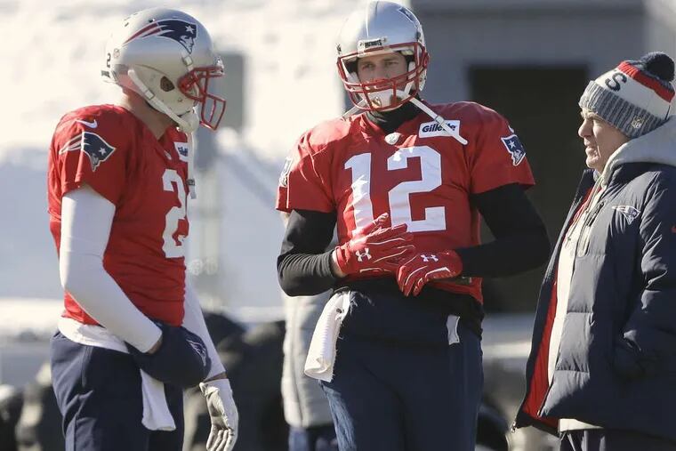 New England Patriots quarterbacks Brian Hoyer, left, and Tom Brady, center, stand with head coach Bill Belichick, right, during an NFL football practice, Thursday, Jan. 18, 2018, in Foxborough, Mass. The Patriots host the Jacksonville Jaguars in the AFC championship on Sunday in Foxborough.(AP Photo/Steven Senne)