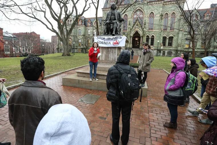 Co-event coordinator Anschel Schaffer-Cohen speaks to about 30 Penn students after a walkout and rally in protest of President Trump&#039;s inauguration on the Locust Walk in the center of campus on Friday.