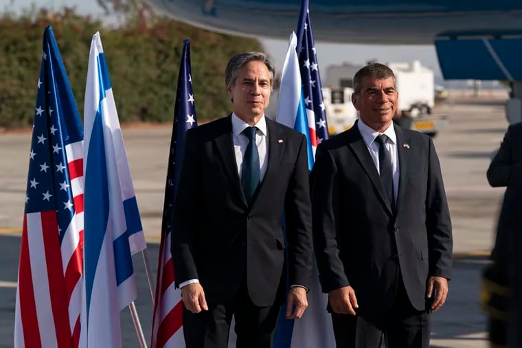 Secretary of State Antony Blinken, left, stands with Israeli Foreign Minister Gabi Ashkenazi upon arrival at Tel Aviv Ben Gurion Airport on Tuesday in Tel Aviv, Israel.
