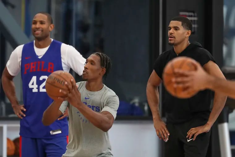 Josh Richardson (middle) is fitting in well with Al Horford (left), Tobias Harris (right), Ben Simmons and Joel Embiid in the Sixers' starting lineup at training camp.