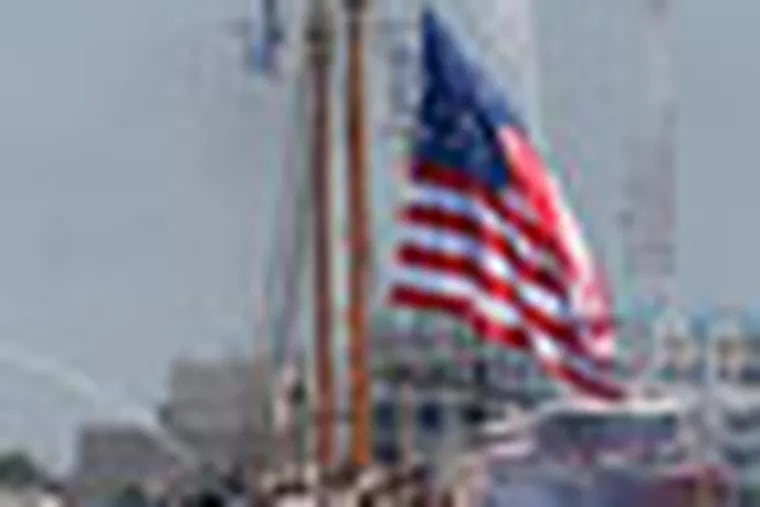 The Coast Guard tall ship Eagle leads other tall ships and escort vessels into Norfolk harbor as the schooner Virginia unfurls the flag of 1812 during a parade of sail for OpSail 2012 in Norfolk, Va., Friday , June 8,, 2012. (AP Photo/Steve Helber)