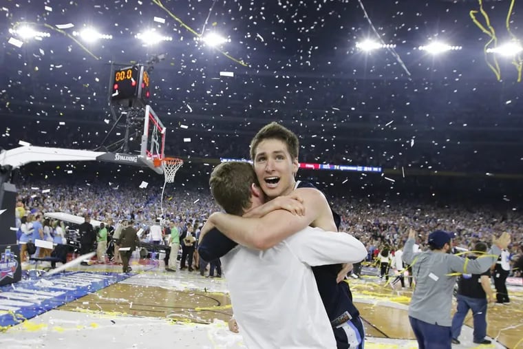 Ryan Arcidiacono of Villanova leaps into the arms of teammate Patrick Farrell after winning the NCAA Men’s Basketball Championship at NRG Stadium in Houston on April 4, 2016.
