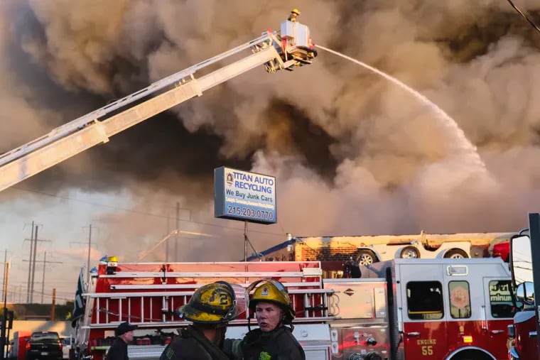 A junkyard fire burns at Titan Auto Recycling in North Philadelphia on Tuesday, September 27, 2022.