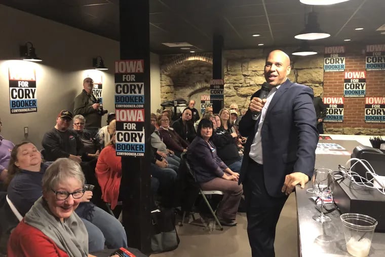 Sen. Cory Booker (D., N.J.) speaks to voters as he campaigns for the Democratic presidential nomination at the Riverbend Pub and Grill in Manchester, Iowa on Dec. 6, 2019.